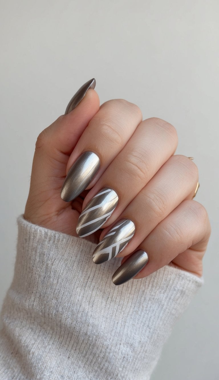 A metallic sheen short nail art design with geometric patterns on a neutral background