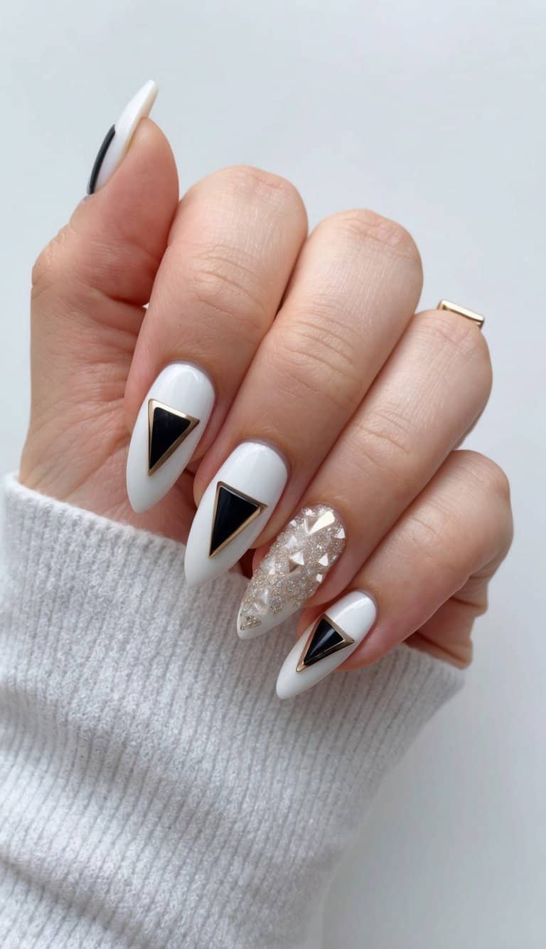 A hand with geometric triangle accents on elegant bridal nails