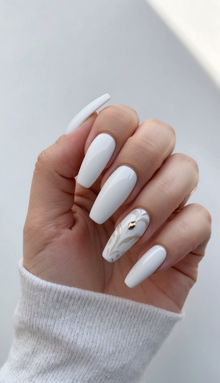 A close-up of coffin-shaped nails with elegant white nail art designs
