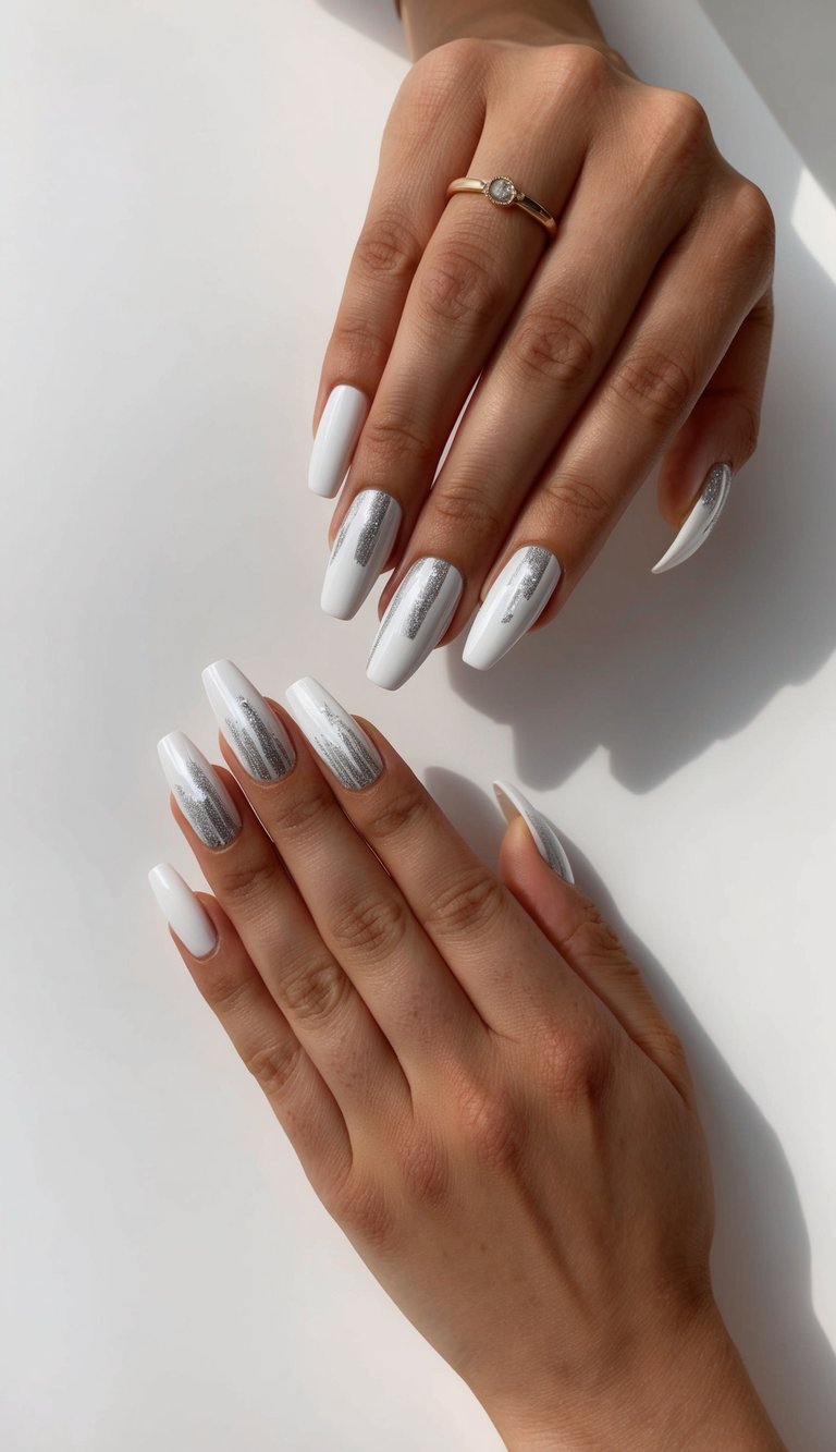 White nails with shimmering silver foil streaks, reflecting a subtle winter light effect for an elegant seasonal style.