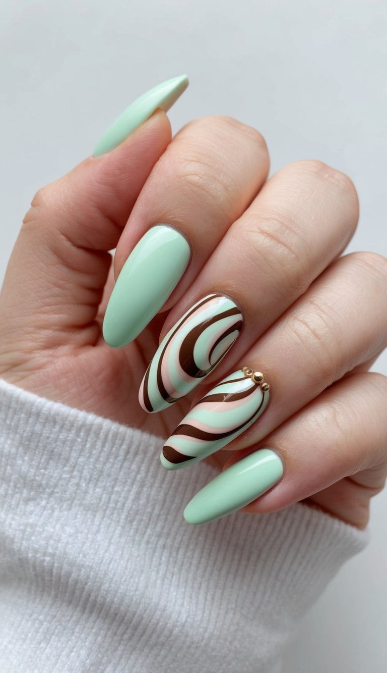 A mint chocolate swirl nail art design with soft pastels and minimalistic elements