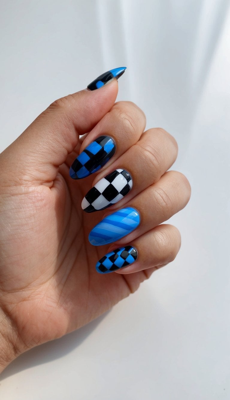 A close-up of black and blue checkered nail art designs on a glossy surface, with various patterns and shades