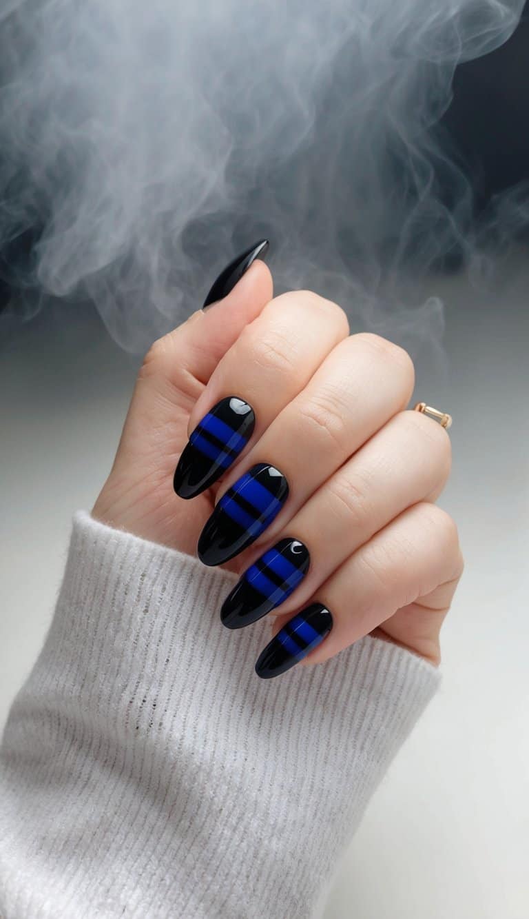 A sleek, glossy nail with alternating black and blue stripes, set against a smoky, moody background