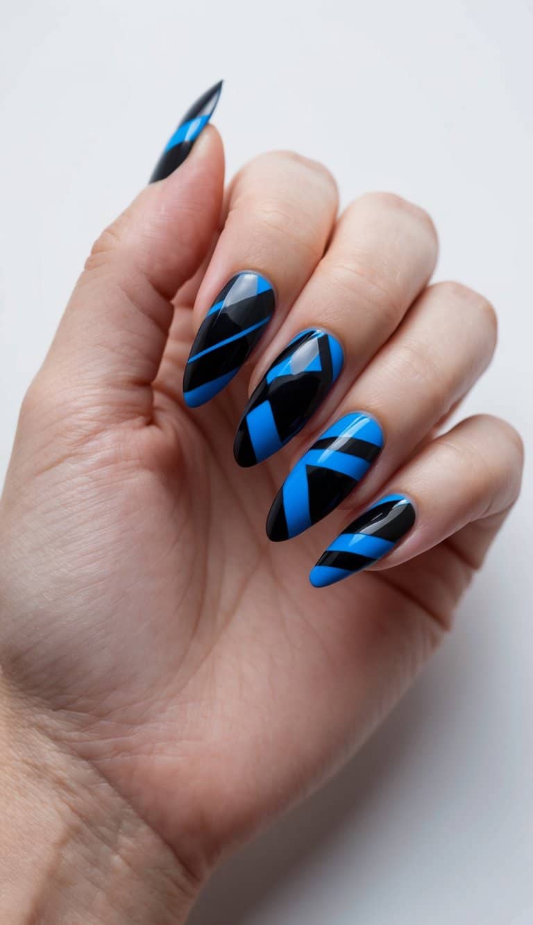A sleek, graphite-inspired nail design featuring bold black and vibrant blue geometric patterns