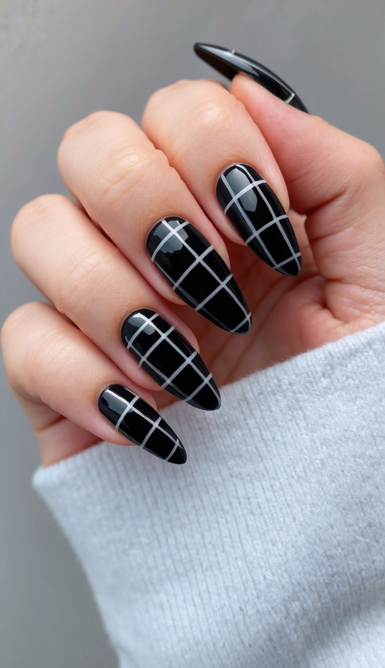 A sleek black plaid nail design with edgy and bold elements