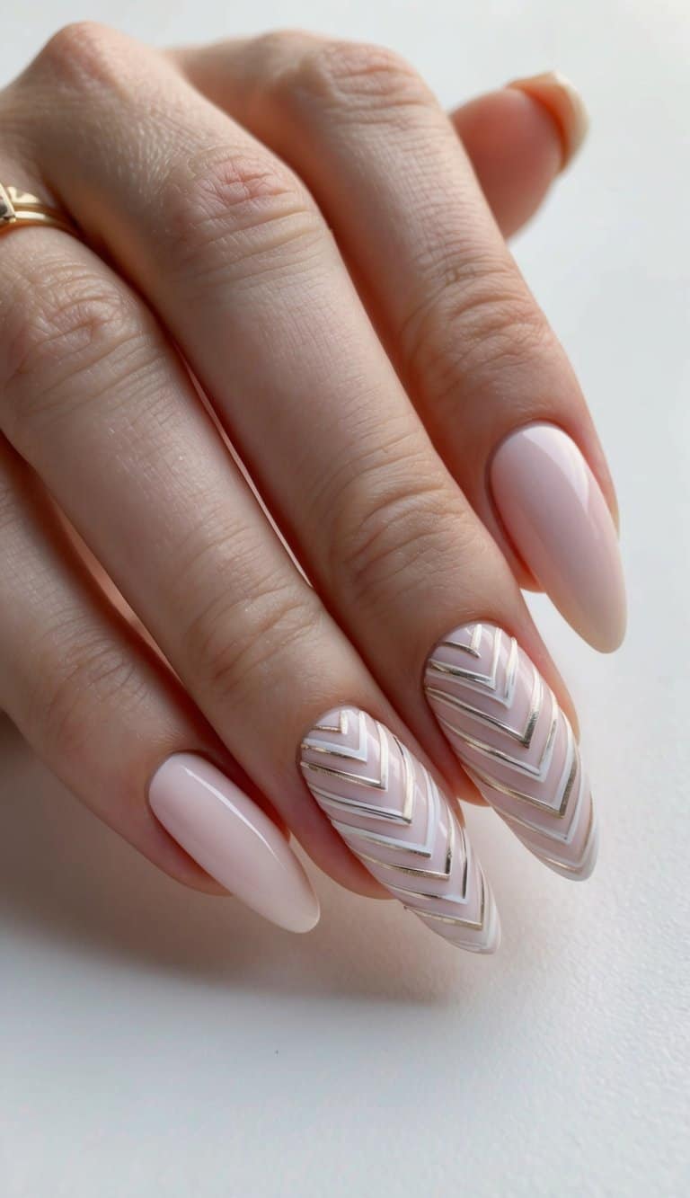 A close-up of a bridal nail art design featuring intricate chevron patterns in soft, pastel colors