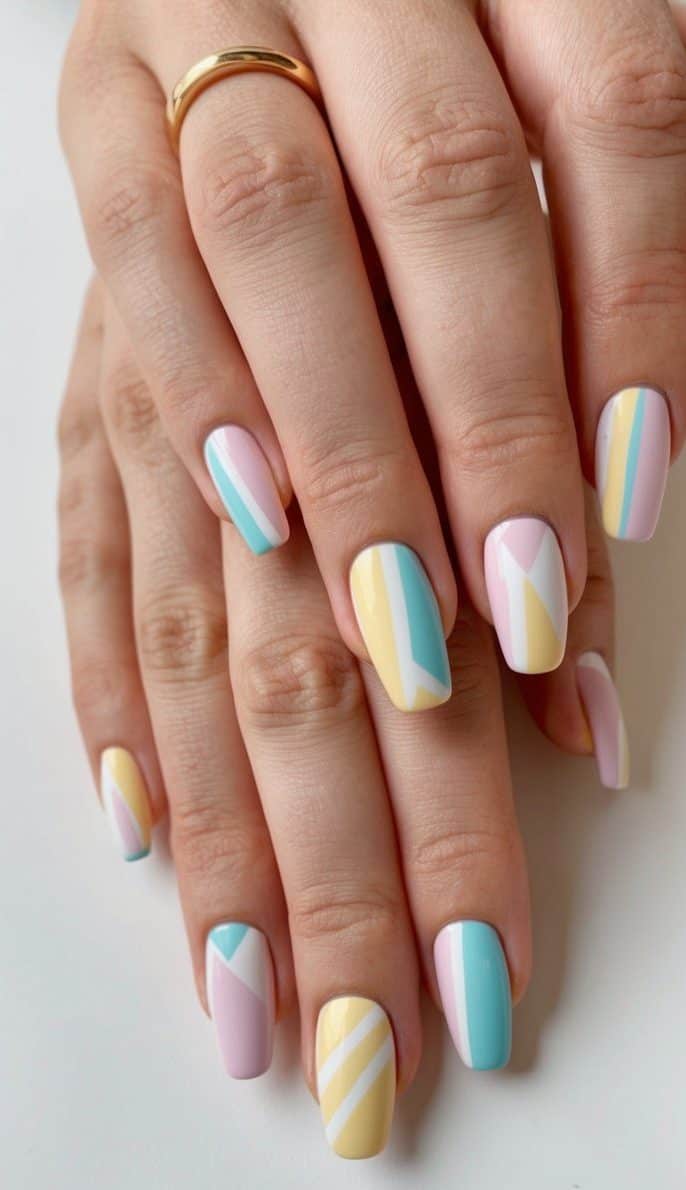 A collection of pastel-colored nails with playful geometric patterns
