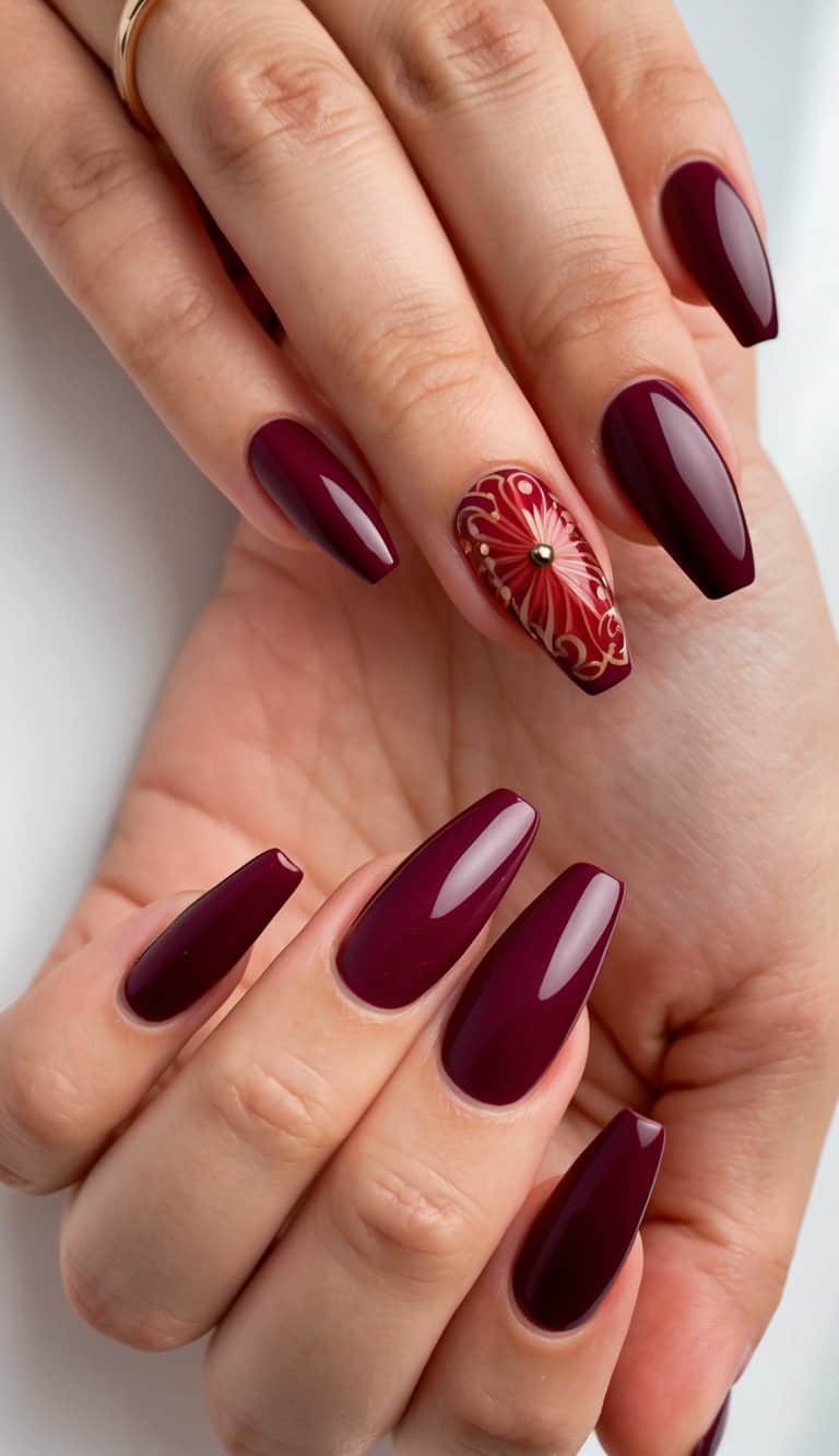 A set of bold burgundy nails with charming red nail art designs
