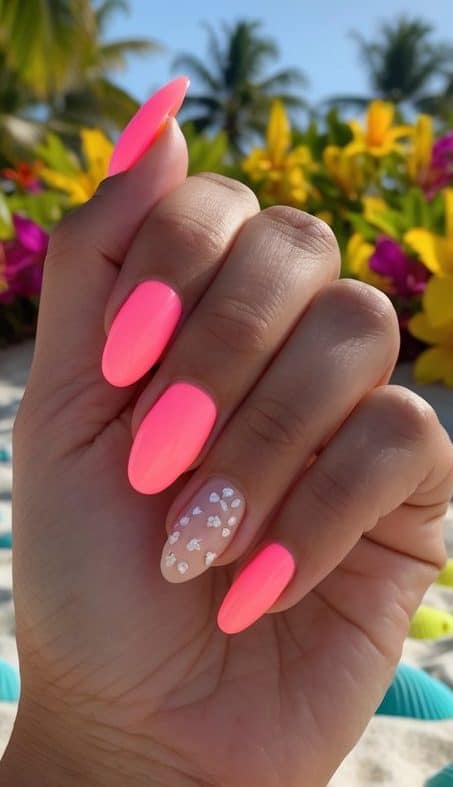 Vibrant neon pink nails with a sheer accent featuring tiny shimmering hearts, creating a tropical and playful summer nail design.