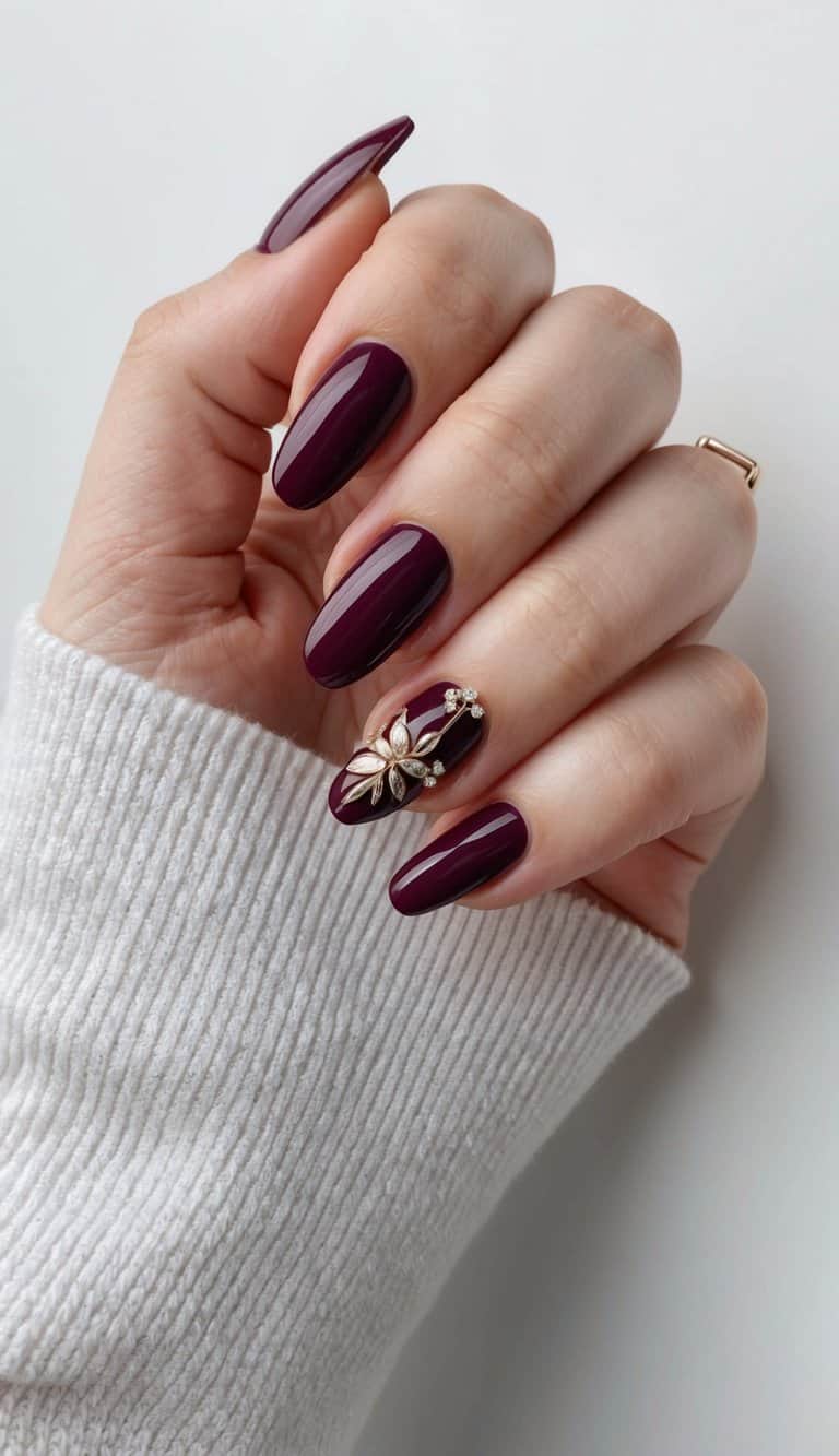 A hand with perfectly manicured nails in a deep merlot shade, adorned with elegant and polished formal nail art designs