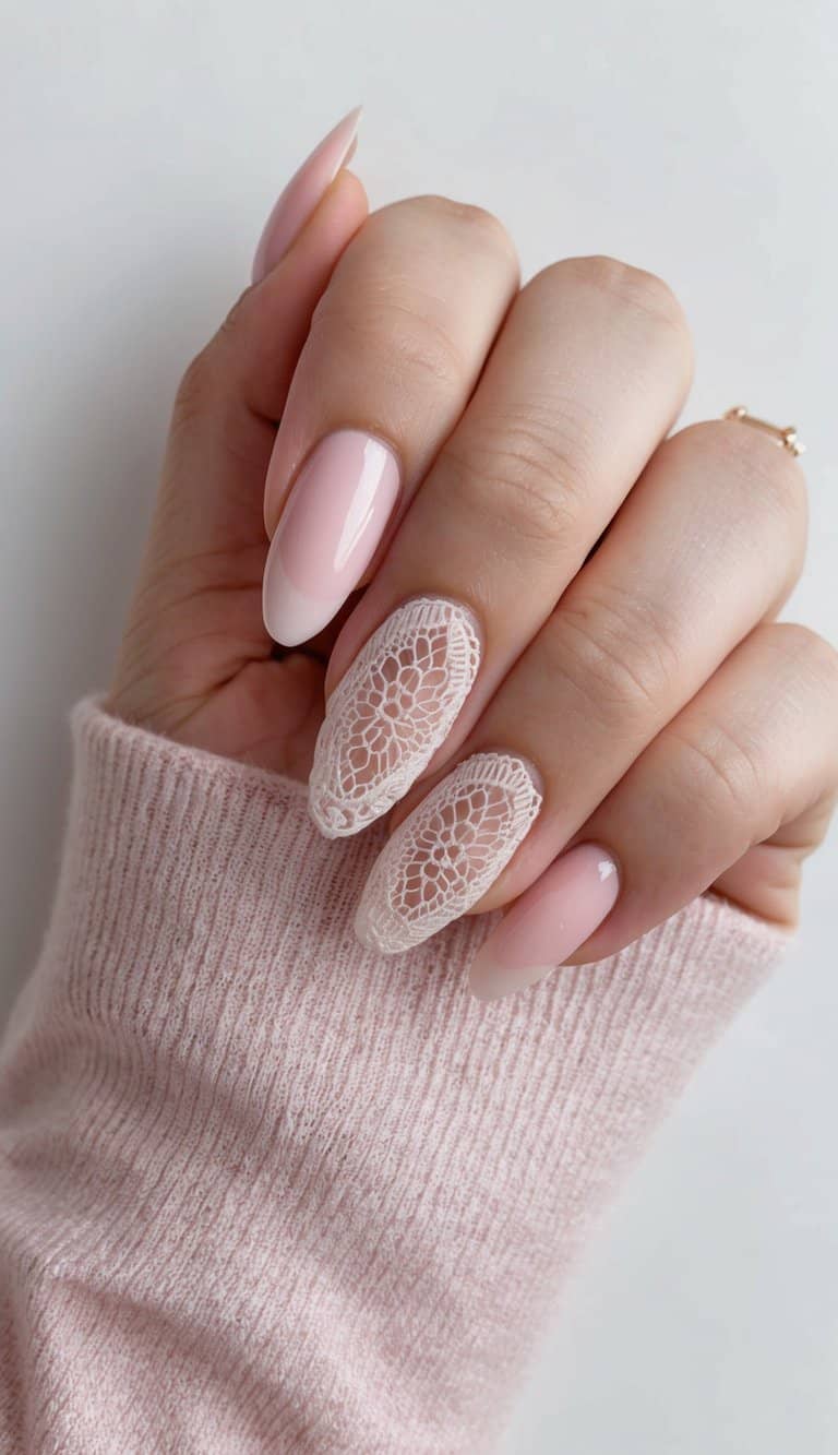 A soft pink lace nail art design with delicate girly details