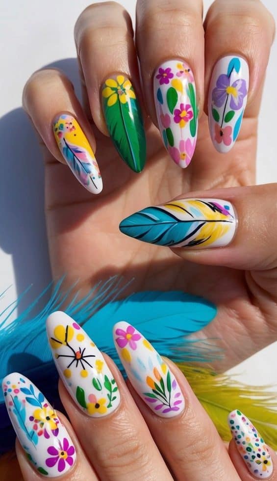 A colorful array of feathers, flowers, and playful patterns adorn a set of manicured nails, showcasing a variety of fun nail art ideas