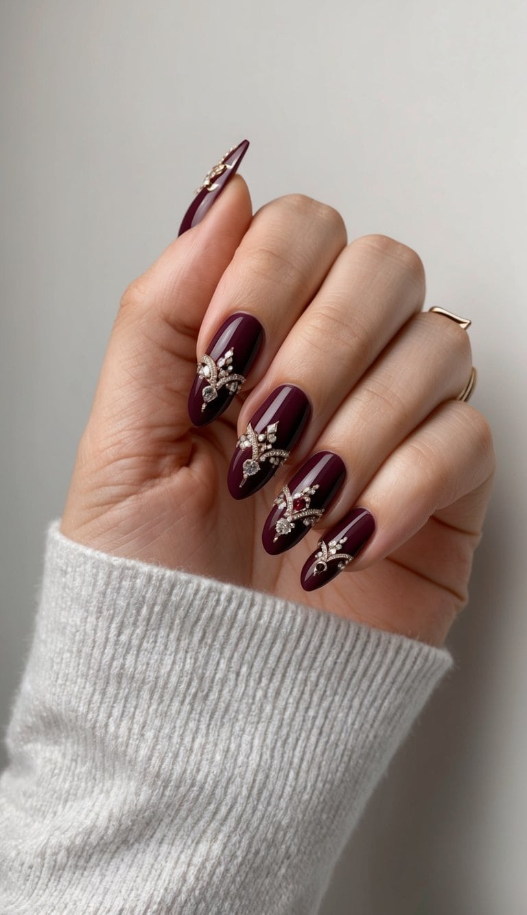 A close-up of elegant burgundy nails adorned with intricate designs and shimmering details, set against a sophisticated background