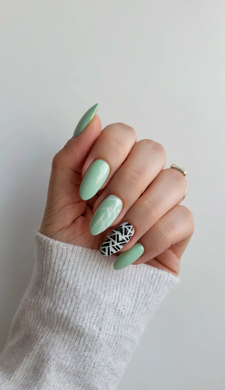 A mint green nail with tribal elements on a clean, modern background