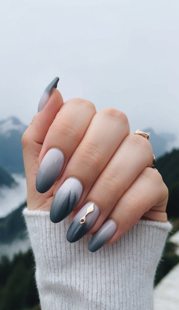 A misty mountain landscape with elegant gray ombre nail art designs