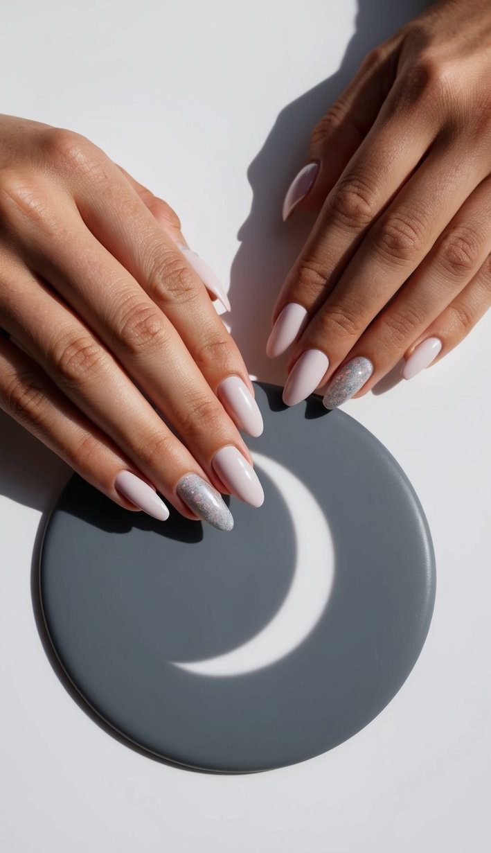 A crescent moon casting shadows on a smooth, gradient gray surface