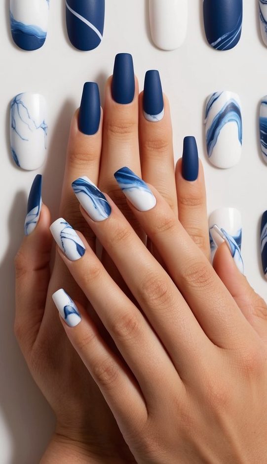 A collection of 50 blue and white marble matte nail art designs displayed on a clean, minimalist background