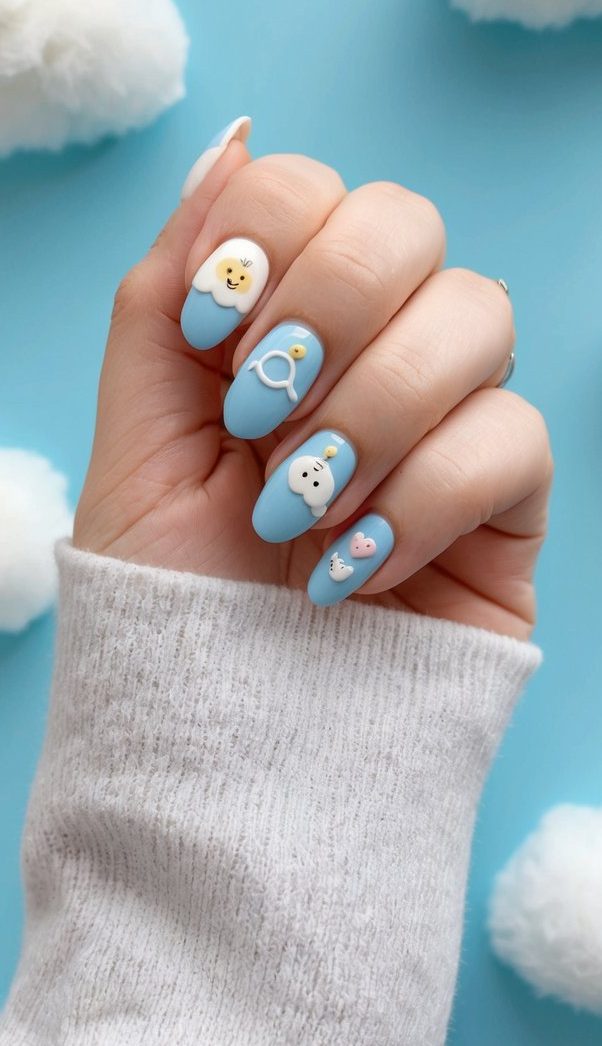 A baby blue background with fluffy white clouds, featuring various cute baby shower-themed nail art designs