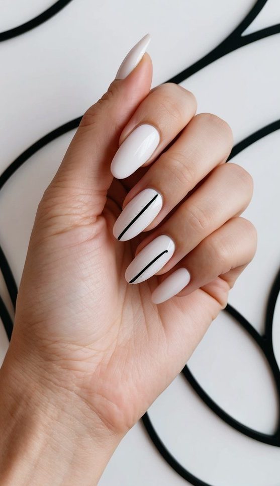 A hand with minimalist nail art against a backdrop of artistic wave patterns in sleek, modern design