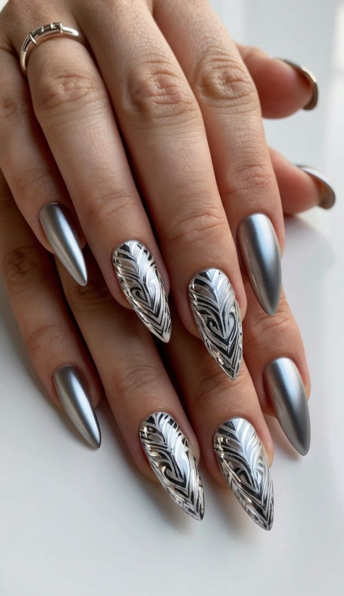 A sleek silver tribal art design adorns a set of metallic accent nails, creating a dazzling and intricate pattern
