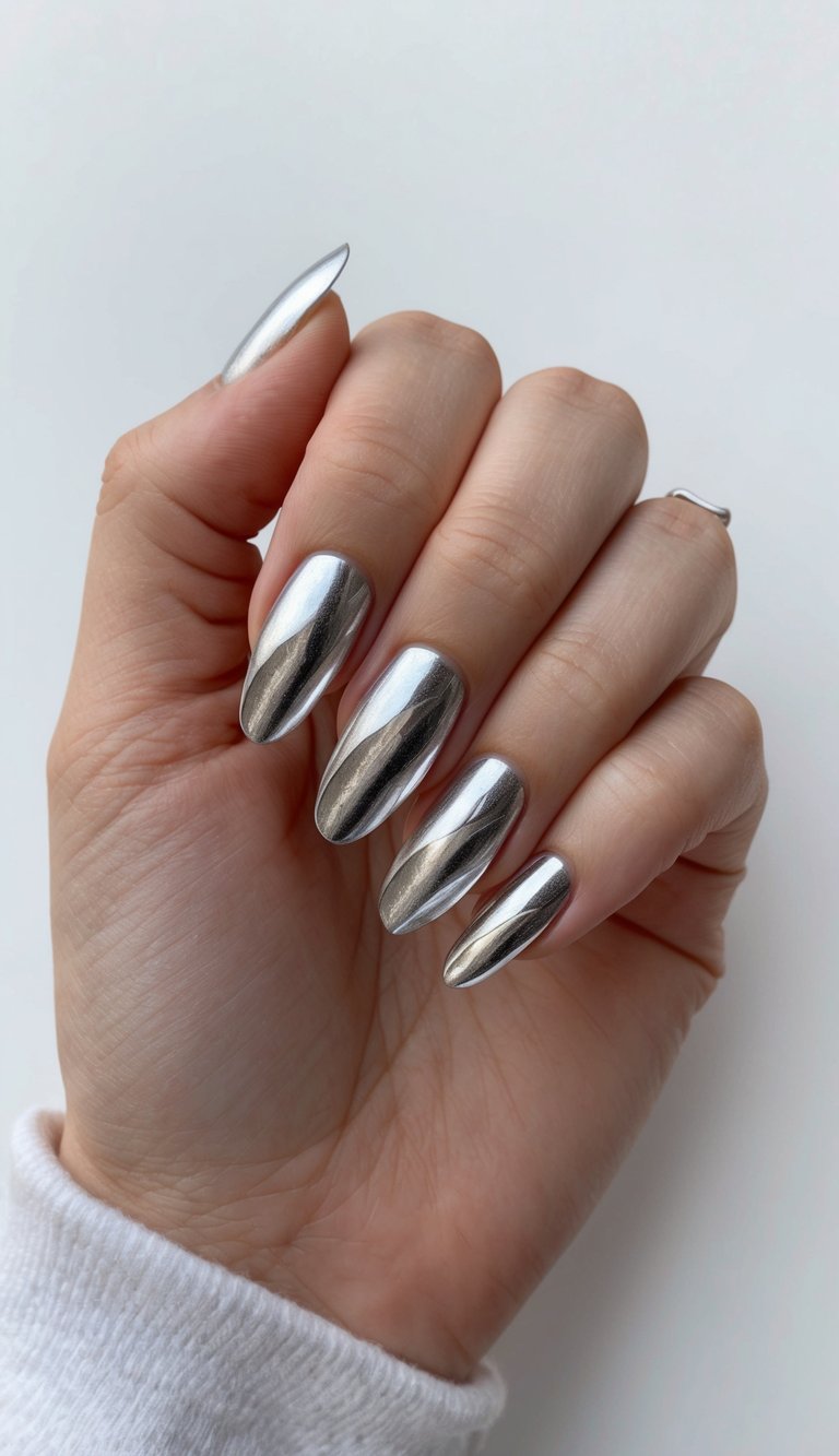 Silver foil waves in metallic accent nail art design