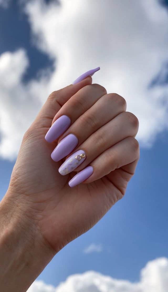Lilac and white clouds fill the sky, inspiring pastel nail art ideas