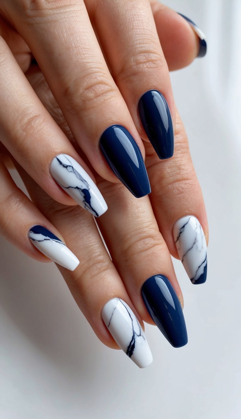 A navy and white marble nail design with bold and classic style