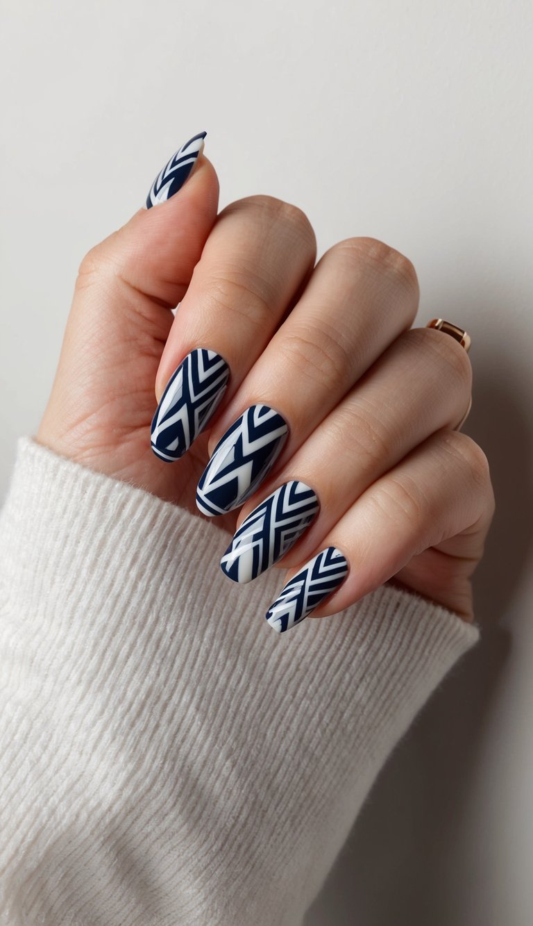 A navy aztec patterned nail art design on a neutral background with bold and classic style