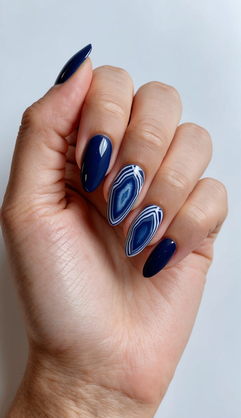 A navy geode nail art design with bold and classic patterns, featuring rich navy colors and intricate details