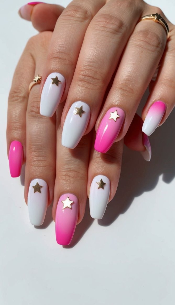 Pink and white ombre nails with delicate star designs on a clean, minimalist background