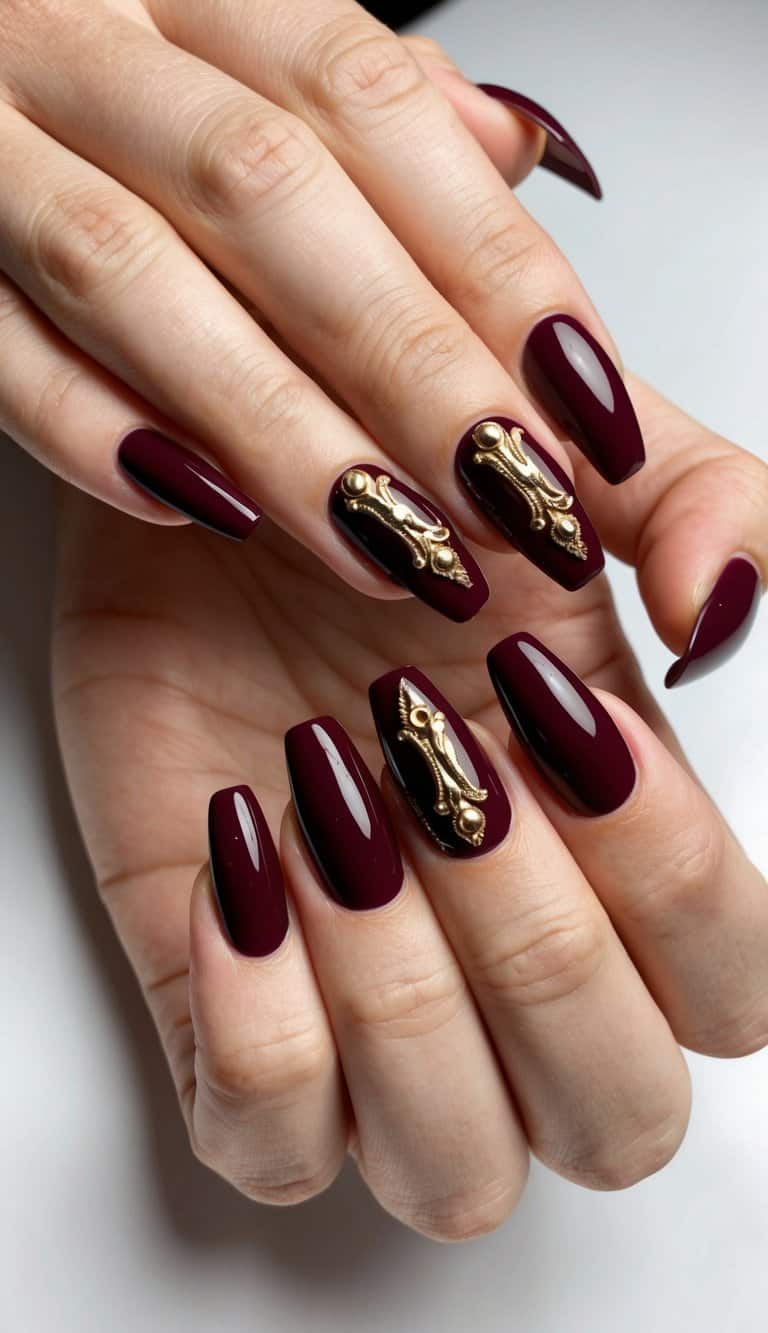 A bold burgundy nail polish with intricate gold accents, perfect for prom night