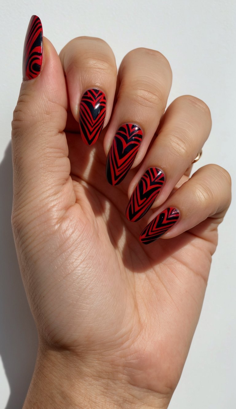 A bold red and black tribal pattern nail art design