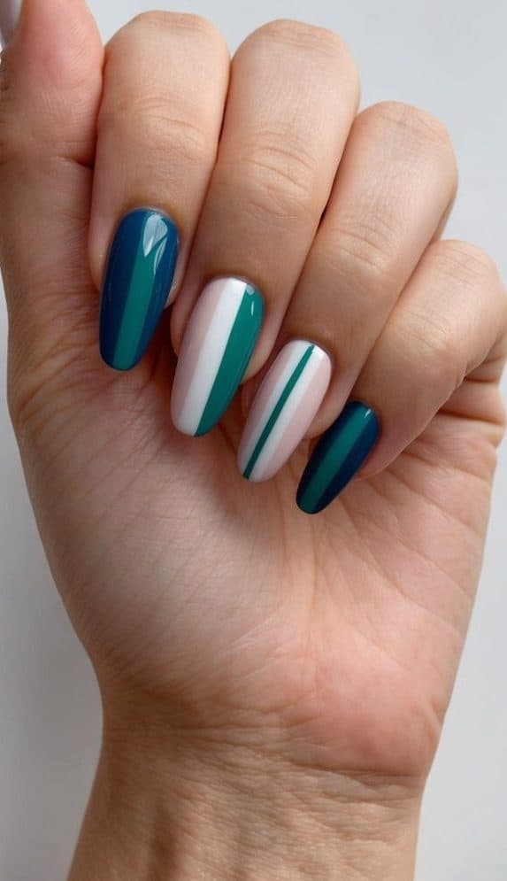 A sleek and modern chevron nail design in various colors on short nails