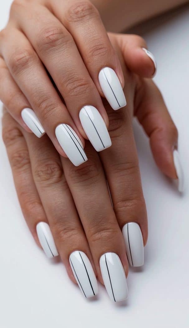 A minimalist scene with clean, white lines showcasing 50 white nail art ideas
