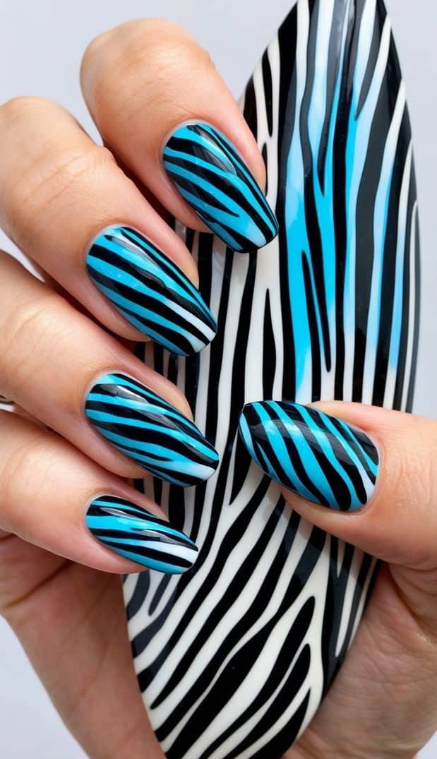 A zebra with electric blue and black stripes in a nail art themed setting