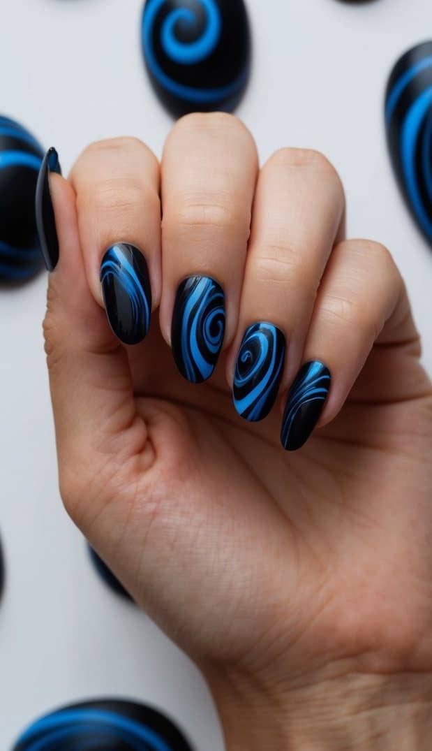 A dark and moody background with swirling black and blue nail designs scattered across the image