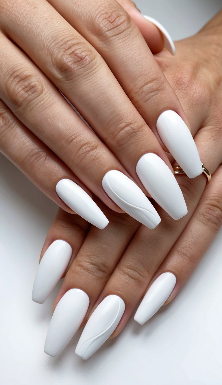 Long matte white coffin nails with soft curved ridges etched into the surface for a clean, sculptural finish.