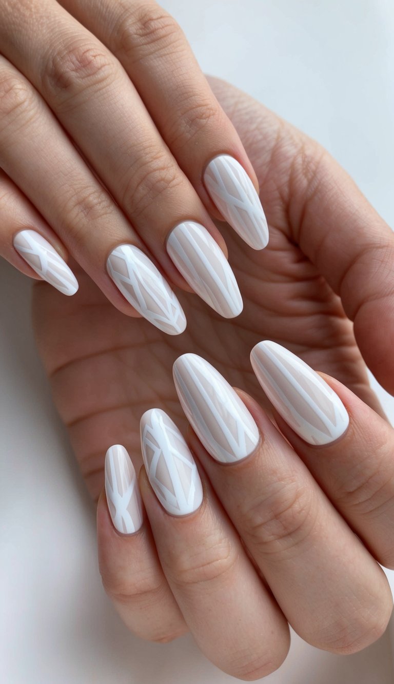 A clean, modern nail design with white geometric patterns on a matte background