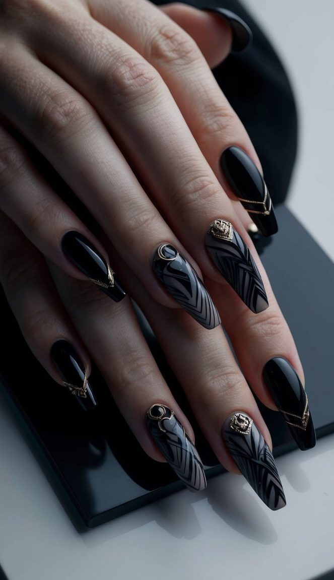 Coffin nails with swirling marble designs, glossy black polish, and elegant gold embellishments for a rich dramatic effect.