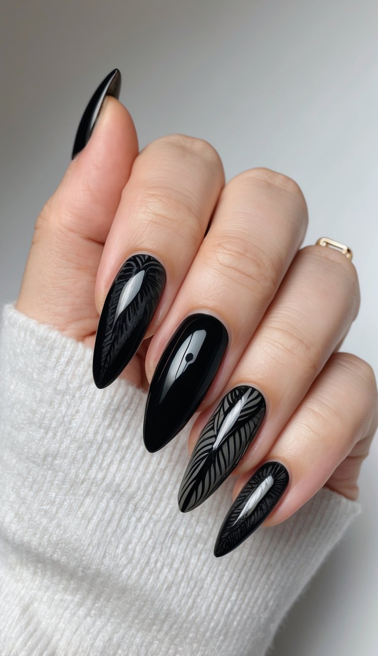Elegant black almond nails layered with shadowy matte leaf prints, offering a chic monochrome design with natural flair.