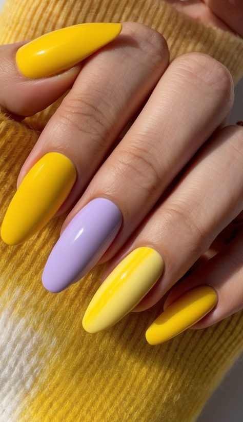 A vibrant array of yellow nail art designs, ranging from soft pastels to bold and bright shades, displayed on a clean, white surface