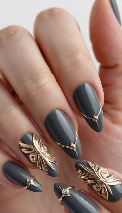 Glossy charcoal nails featuring ornate gold filigree and gemstone-like accents, creating a regal and luxurious manicure.