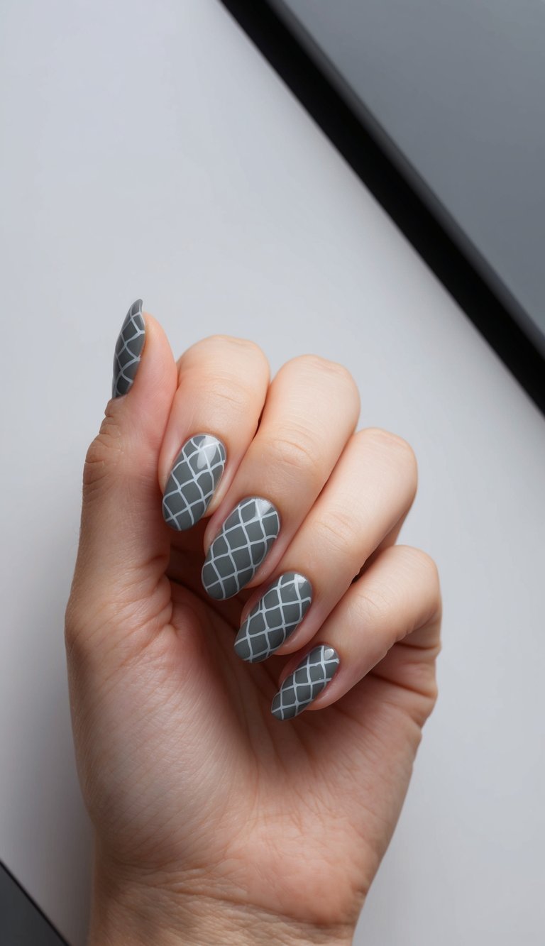 Matte charcoal nails with clean white grid patterns across all fingers, creating a modern and structured nail design.