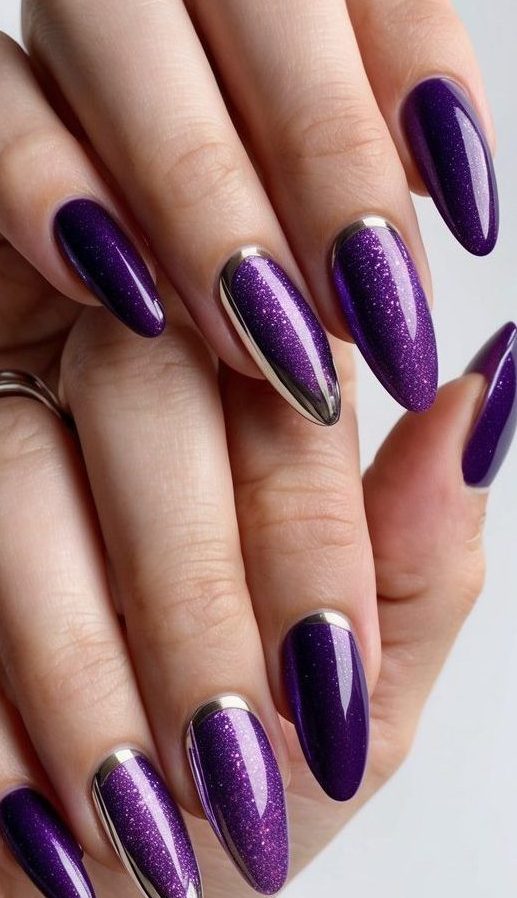 Detailed view of violet shimmer nails with silver chrome cuticle highlights, blending high-shine polish with sleek metallic artistry.