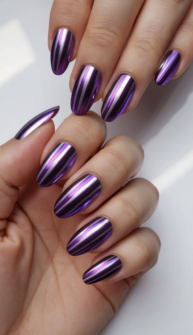 Elegant purple chrome nail art designs with violet and silver stripes