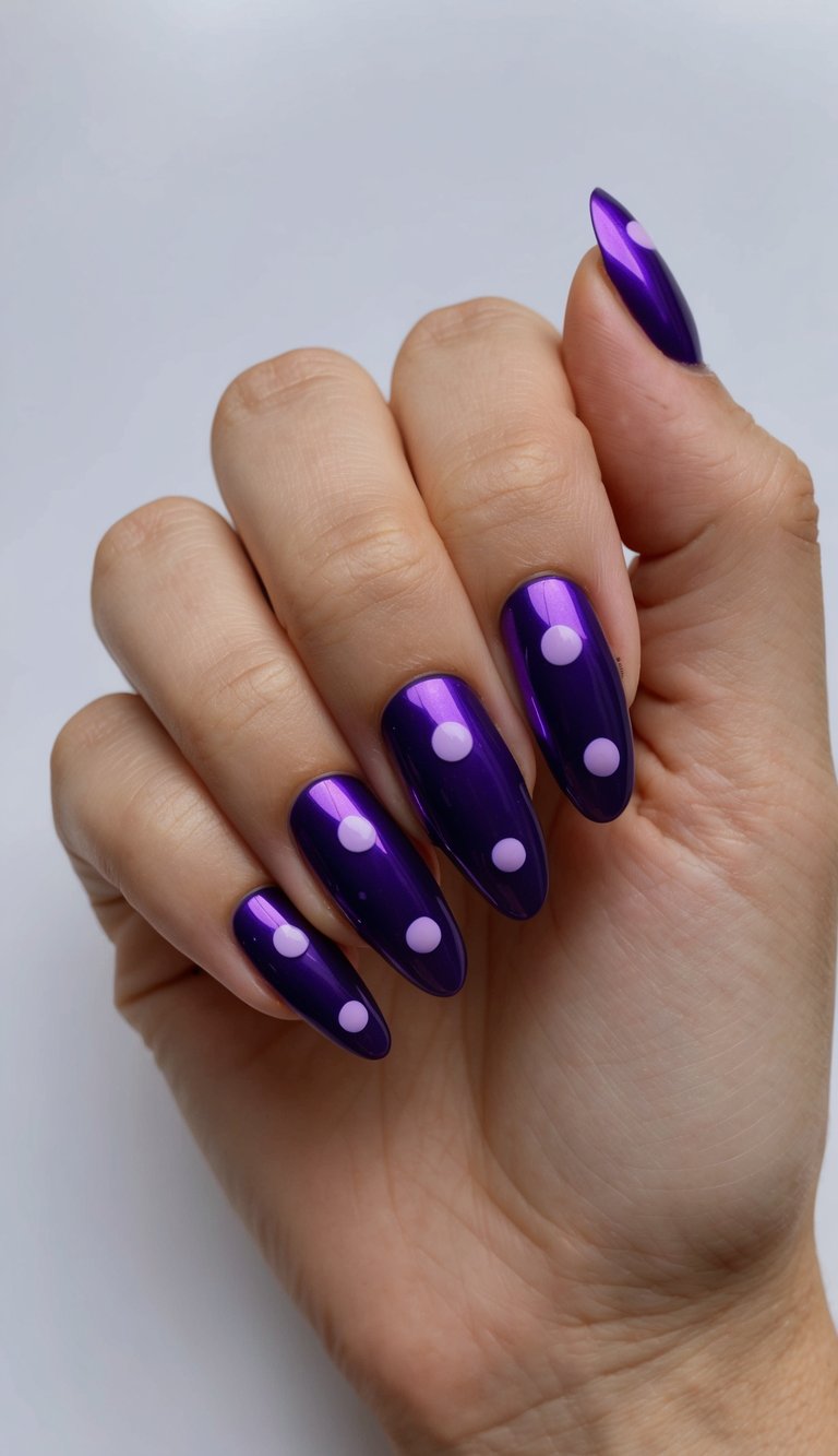 A hand with glossy deep purple dots on chrome nails