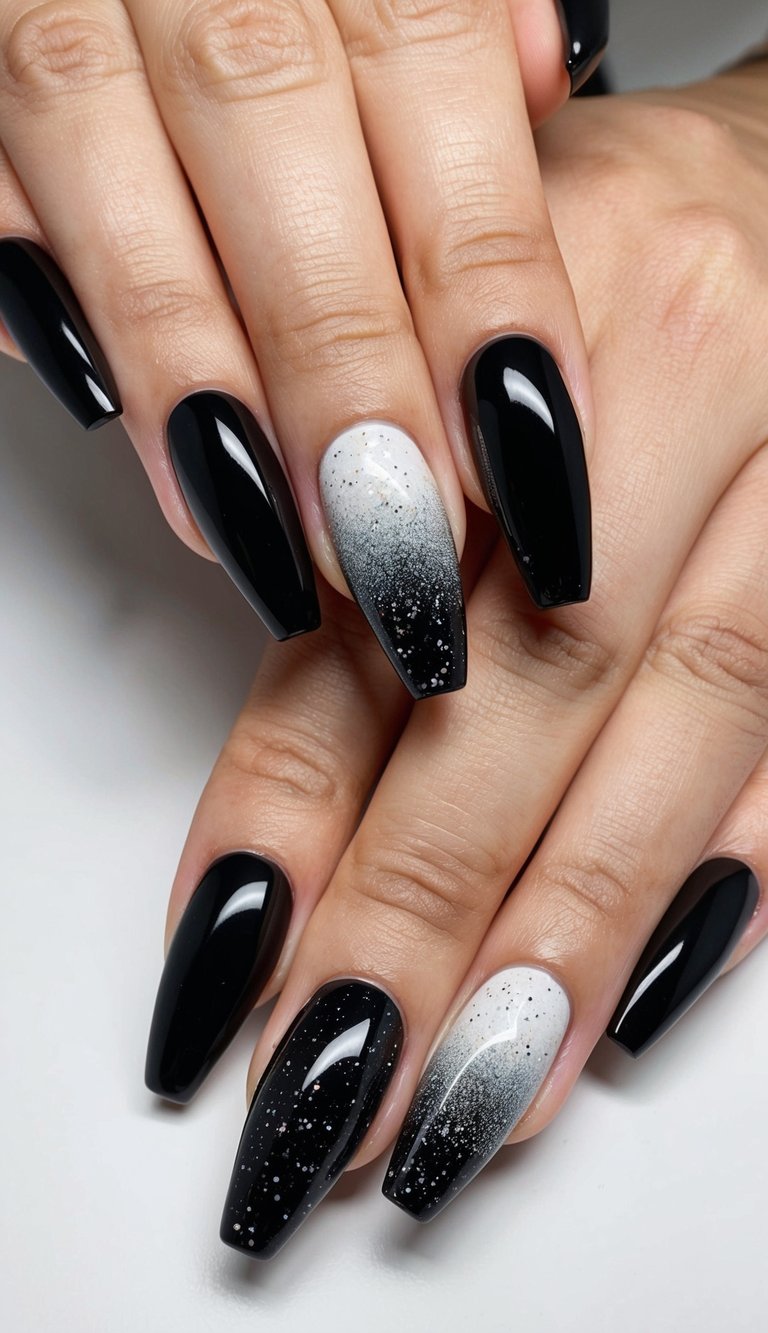 Nails with deep black chrome polish and gradient silver-white accents dusted with fine specks for a soft galaxy-inspired manicure.
