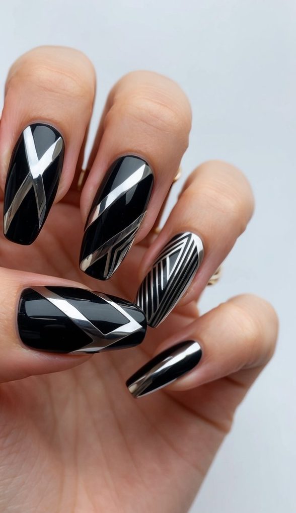 A close-up of black chrome nail art designs with bold geometric patterns and edgy, modern shapes