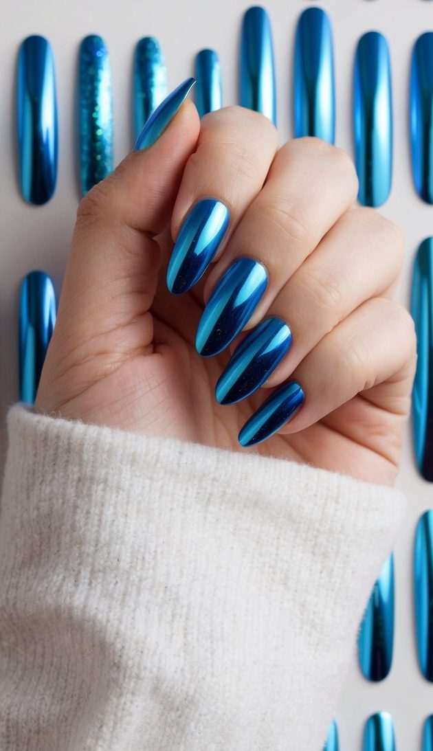 Opal blue chrome slivers reflect light on a backdrop of 50 unique blue chrome nail art designs