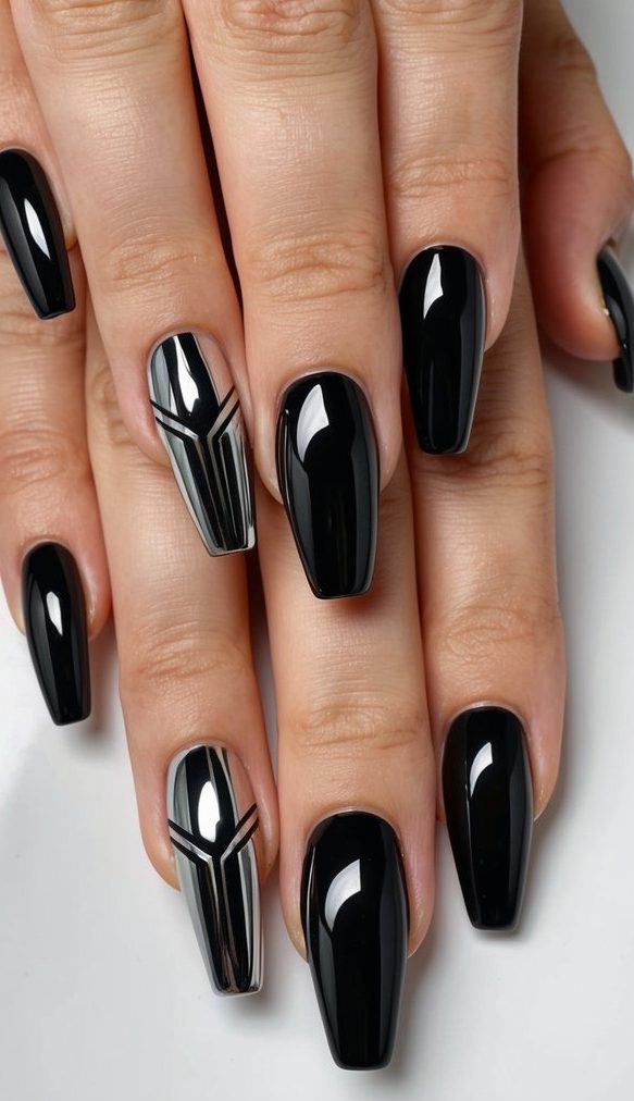 Close-up of glossy black and chrome nails with modern black linework creating symmetrical, geometric shapes across the accent nails.
